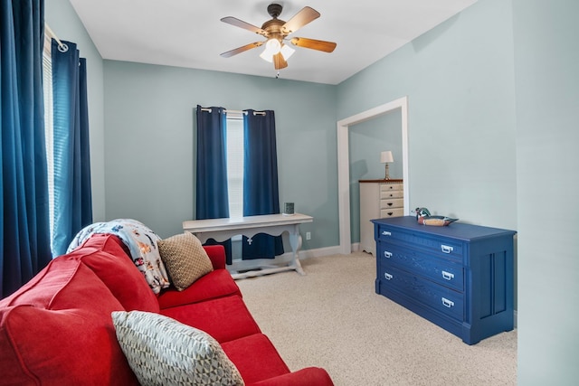 living room with light carpet and ceiling fan