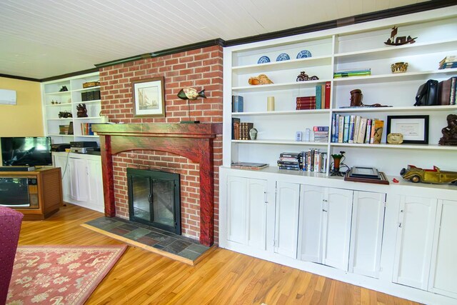 86 Market St, Onancock, VA 23417 - living room with a fireplace and light wood-type flooring