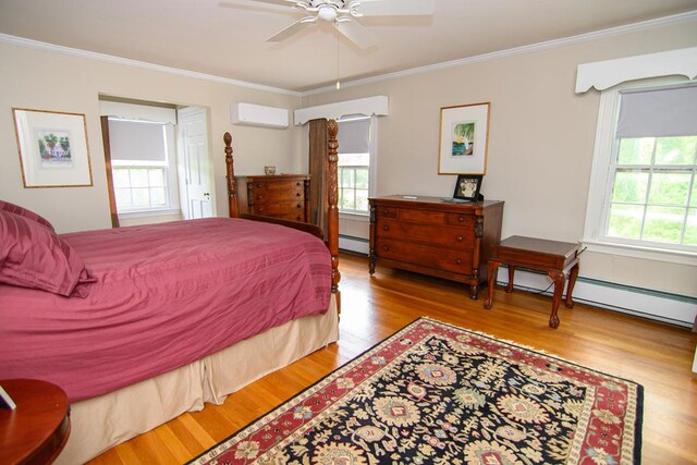 86 Market St, Onancock, VA 23417 - bedroom featuring a wall mounted air conditioner, wood finished floors, ornamental molding, a baseboard radiator, and baseboard heating