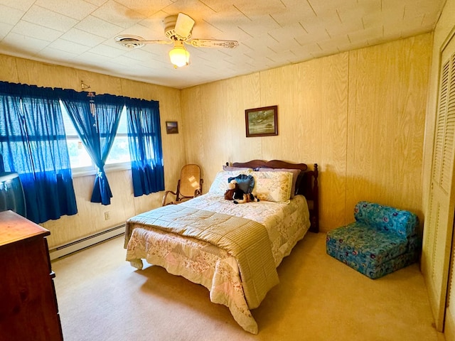 3434 Willow St, Chincoteague, VA 23336 - bedroom featuring baseboard heating, carpet flooring, and wood walls