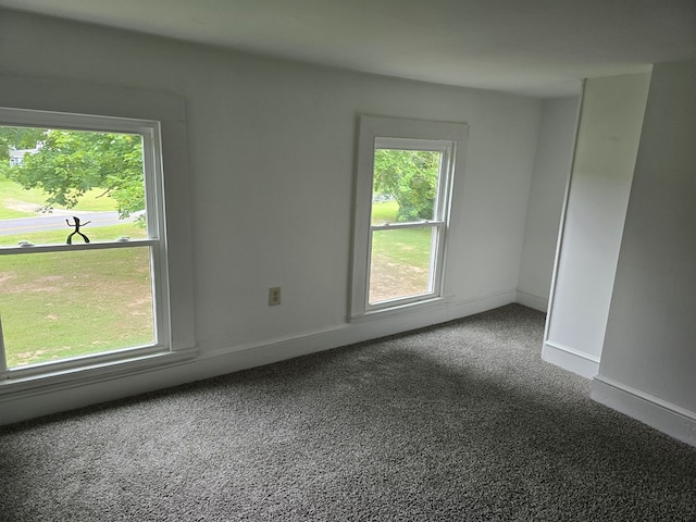 30423 Bobtown Rd, Pungoteague, VA 23421 - spare room featuring dark carpet and baseboards