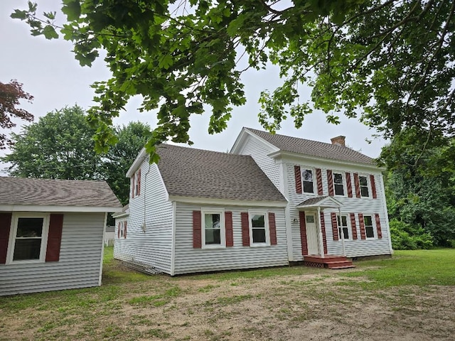 30423 Bobtown Rd, Pungoteague, VA 23421 - colonial house featuring a chimney and a front yard