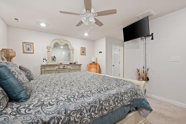 bedroom with ceiling fan and light colored carpet