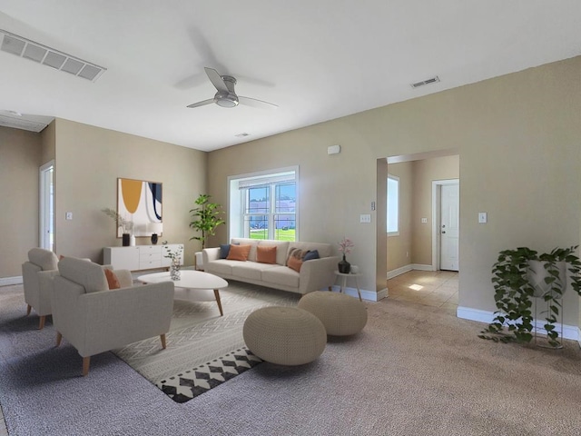 carpeted living room with ceiling fan