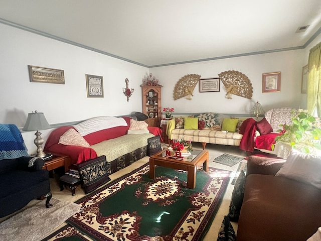 living room with ornamental molding and carpet