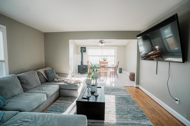 living room featuring light hardwood / wood-style floors and ceiling fan