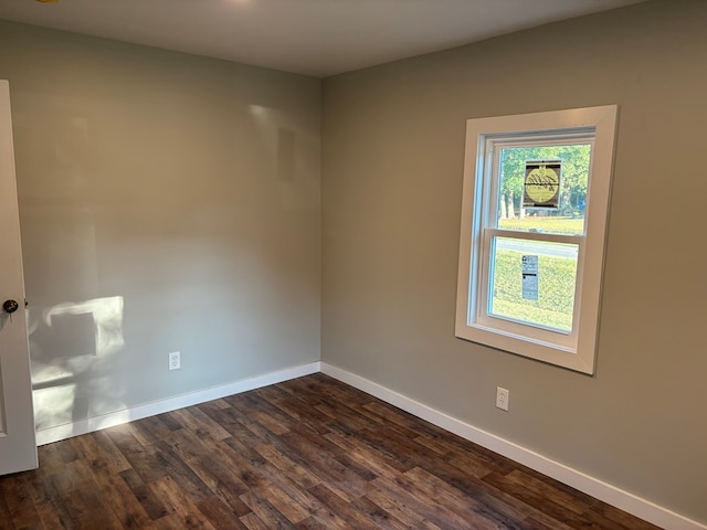 unfurnished room featuring dark hardwood / wood-style flooring