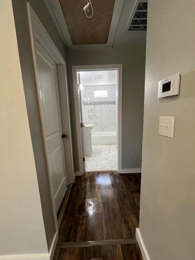 hallway with dark hardwood / wood-style floors