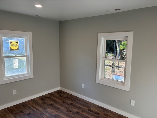 empty room featuring dark wood-type flooring