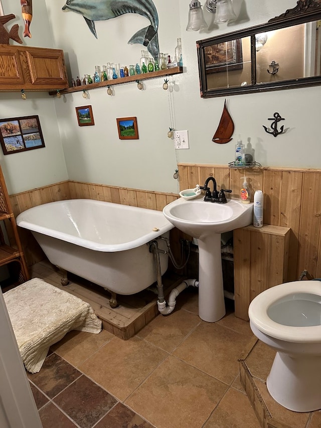 30191 Back Creek Rd, Hacksneck, VA 23358 - bathroom featuring wainscoting, a freestanding tub, and wooden walls