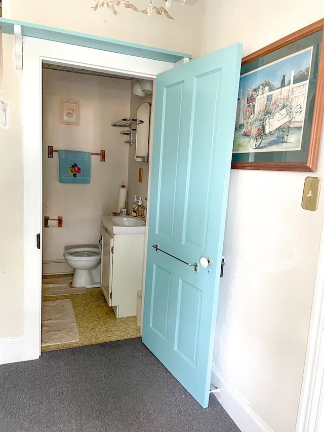 bathroom featuring vanity and toilet