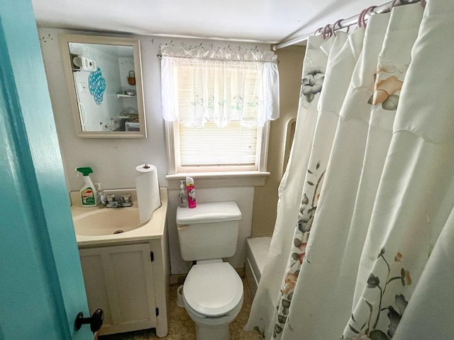 bathroom featuring vanity and toilet