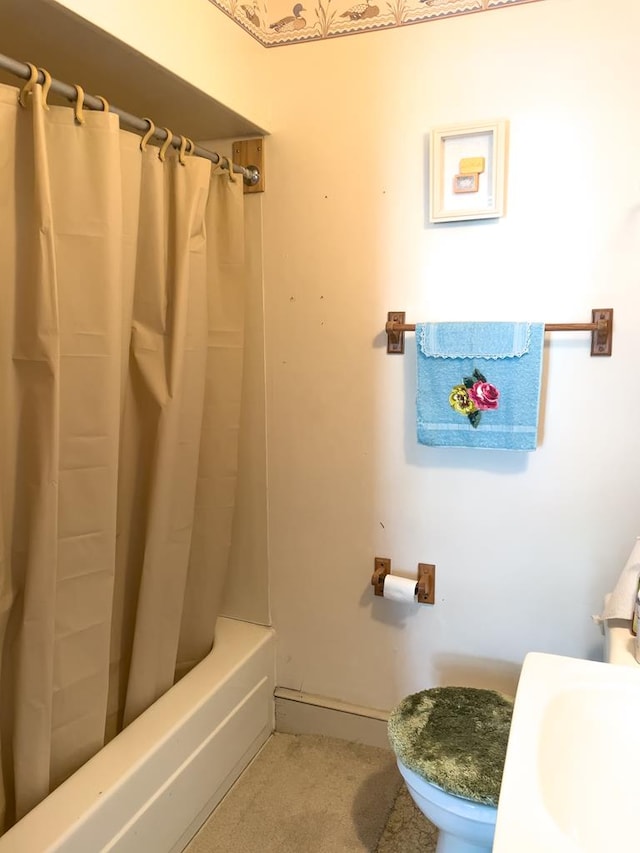 bathroom with shower / bathtub combination with curtain and toilet