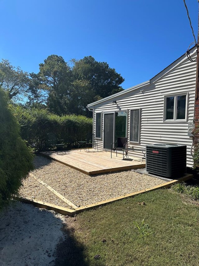 exterior space featuring a deck and central air condition unit