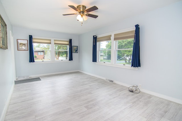 unfurnished room featuring ceiling fan and light wood-type flooring