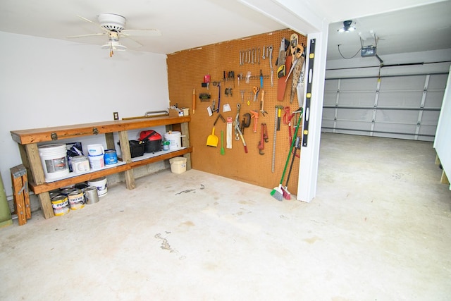 garage with a workshop area, ceiling fan, and a garage door opener