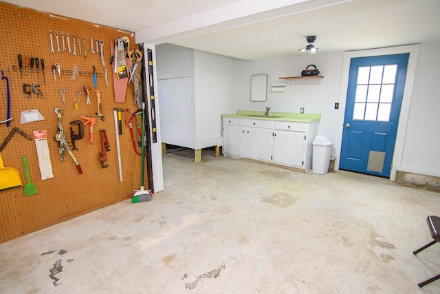 interior space featuring a workshop area and sink