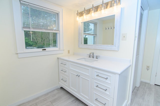 bathroom featuring vanity and hardwood / wood-style flooring