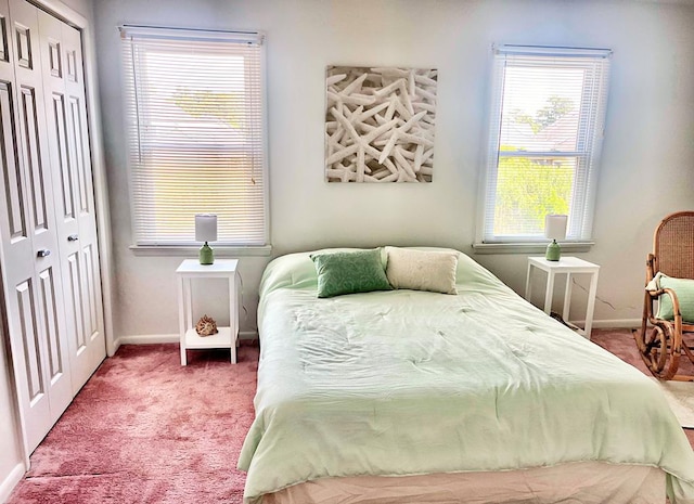 carpeted bedroom featuring a closet