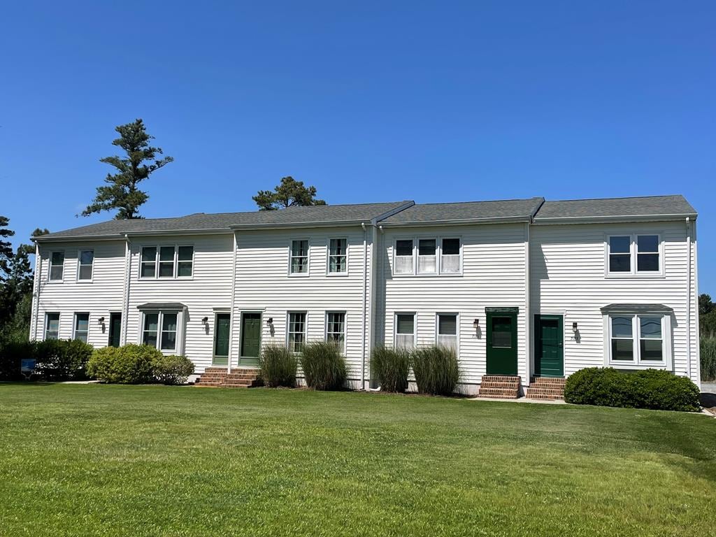 7181 Bunting Rd, Chincoteague, VA 23336 - view of front facade featuring a front lawn and entry steps