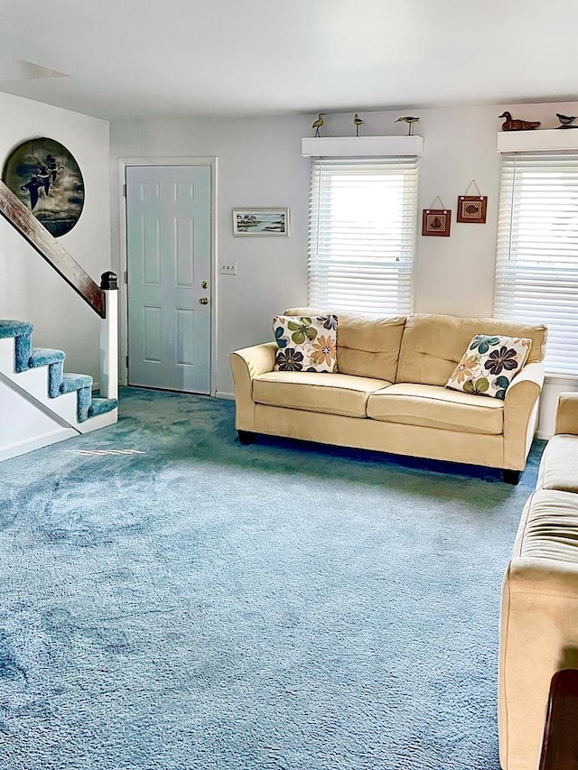 carpeted living room with plenty of natural light