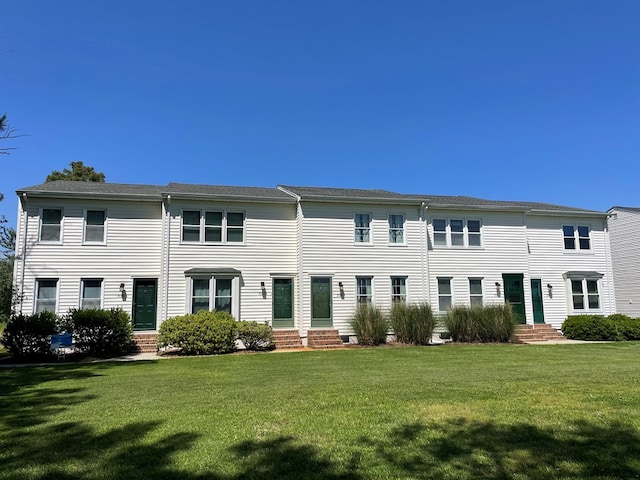 view of front of home with a front lawn