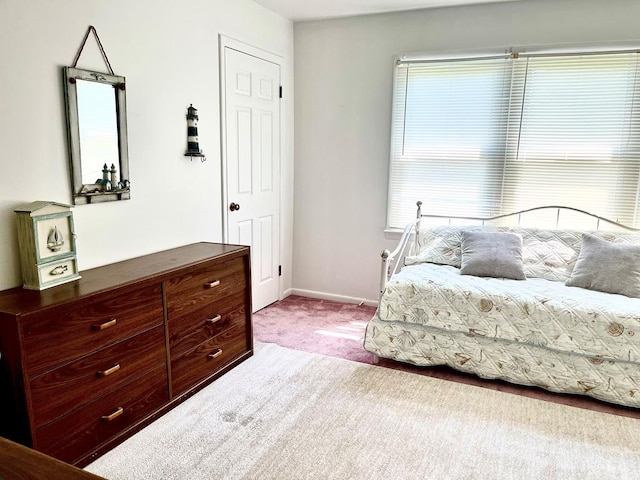 bedroom featuring light colored carpet