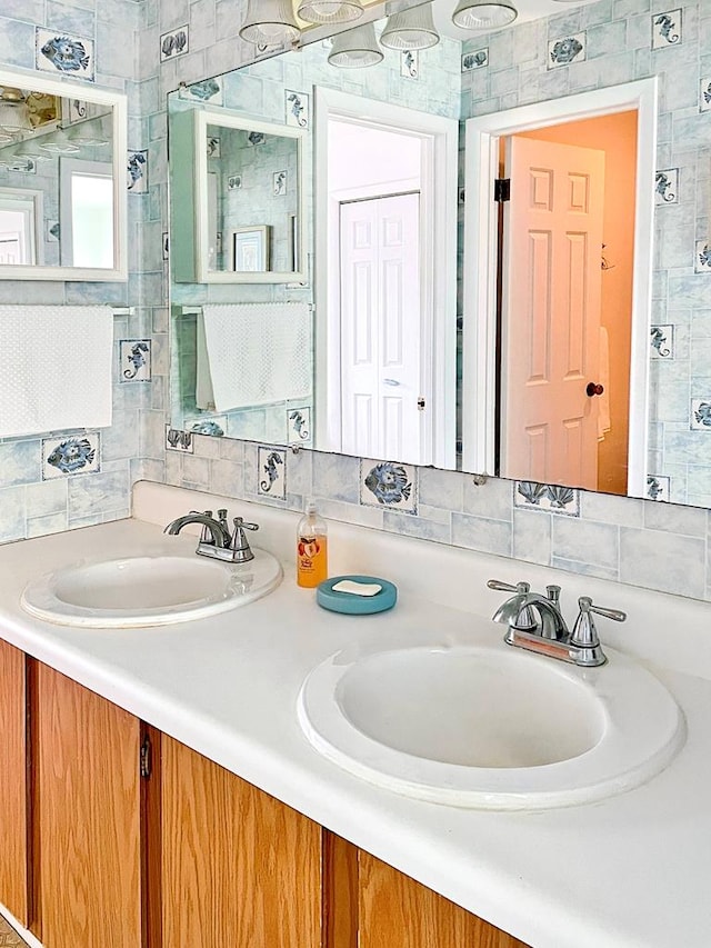 bathroom with vanity and backsplash