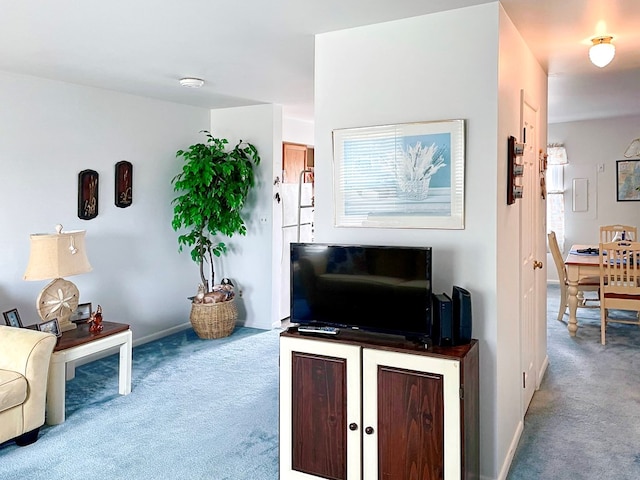 living room featuring light carpet