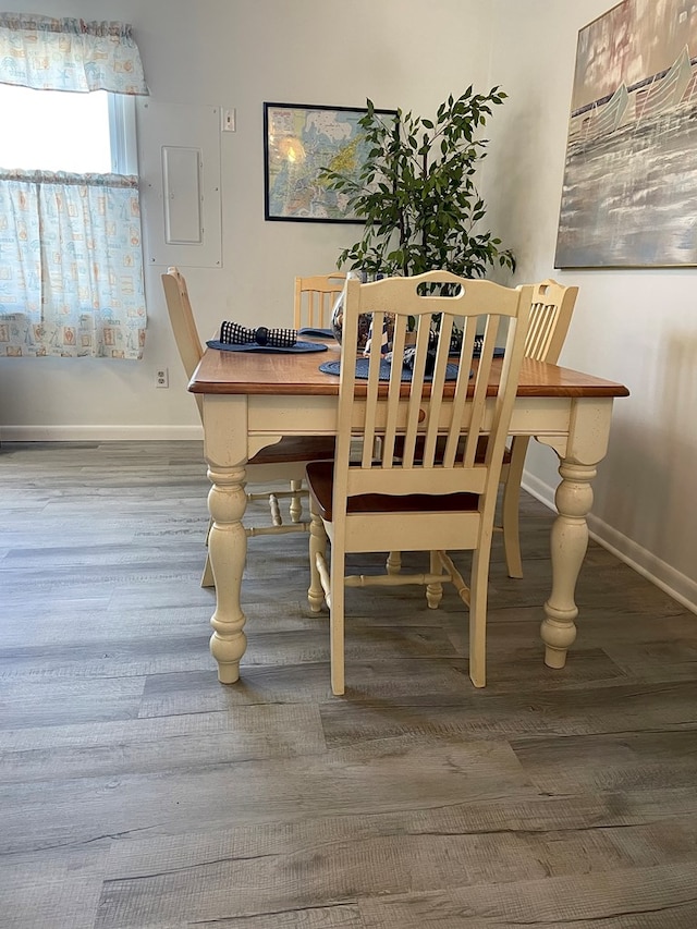 dining area with wood-type flooring