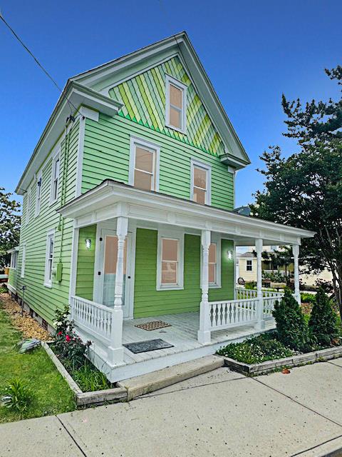 4169 Main St, Chincoteague, VA 23336 - view of front of home featuring covered porch