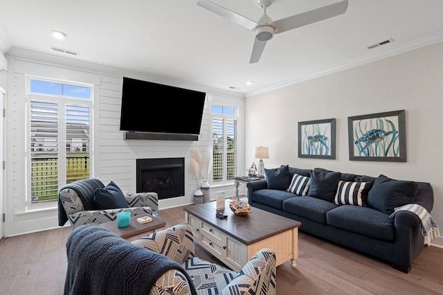 199 Old Course Loop, Cape Charles, VA 23310 - living room with wood finished floors, visible vents, and crown molding