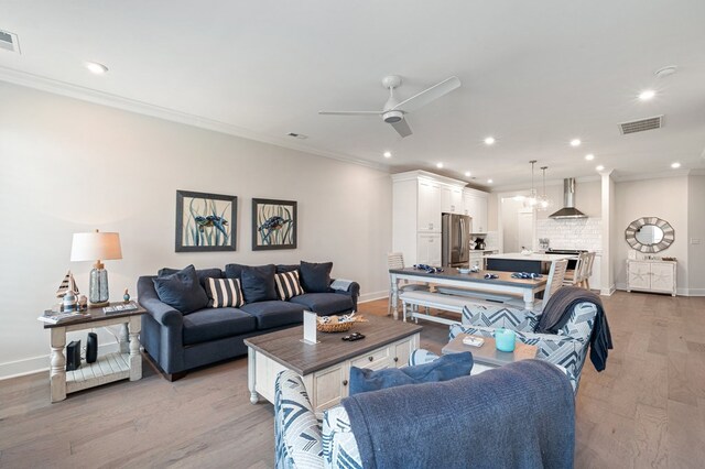 199 Old Course Loop, Cape Charles, VA 23310 - living room featuring baseboards, crown molding, visible vents, and recessed lighting