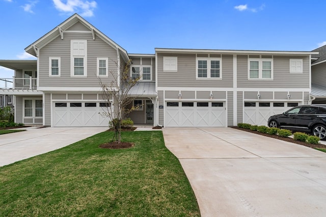 199 Old Course Loop, Cape Charles, VA 23310 - view of front facade featuring concrete driveway, a front lawn, and an attached garage