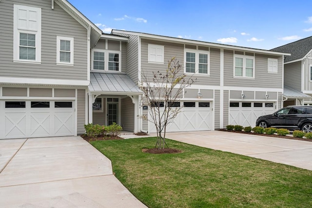 199 Old Course Loop, Cape Charles, VA 23310 - view of front of house featuring an attached garage, a front yard, and concrete driveway