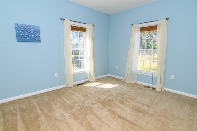 15259 Russell Dr, Onancock, VA 23417 - spare room with plenty of natural light and carpet
