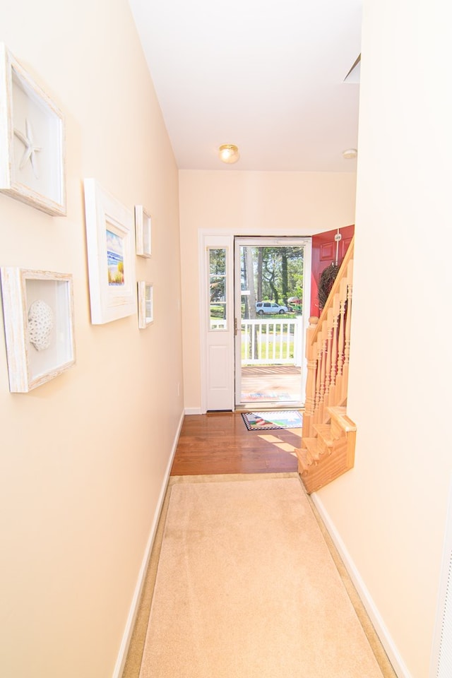 15259 Russell Dr, Onancock, VA 23417 - doorway with stairway and carpet