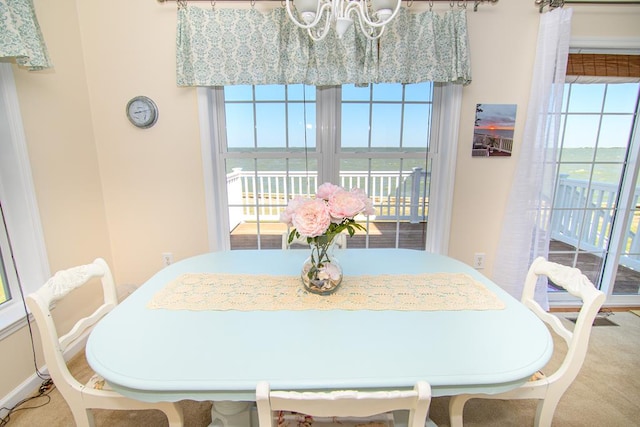 15259 Russell Dr, Onancock, VA 23417 - dining room with a chandelier and plenty of natural light