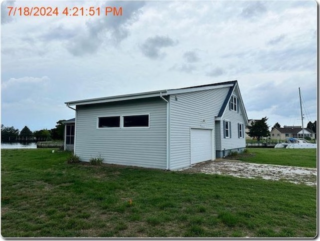 view of property exterior featuring a water view, a garage, and a lawn