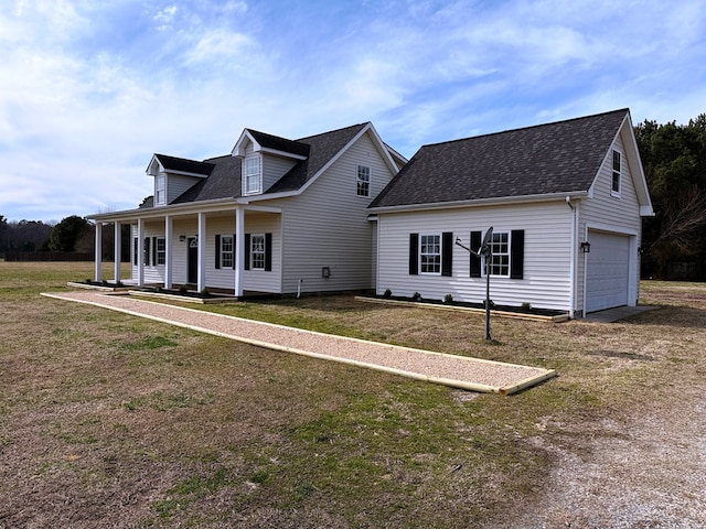 cape cod home featuring a garage, covered porch, a front yard, and a shingled roof