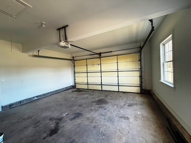 garage with baseboards and a garage door opener