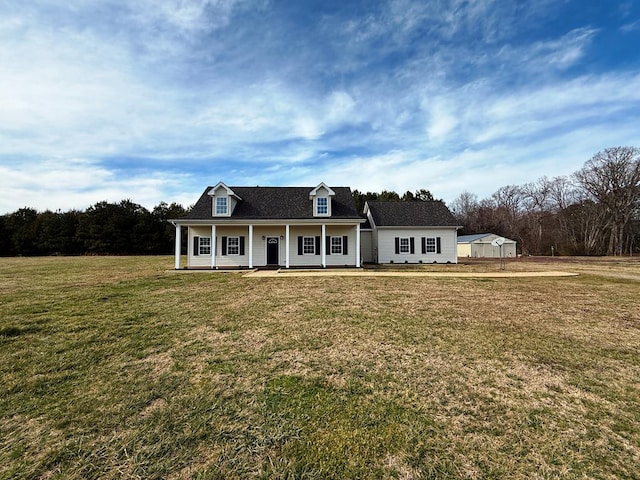 view of front of property featuring covered porch and a front lawn