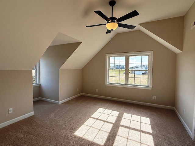 bonus room featuring carpet flooring, ceiling fan, lofted ceiling, and baseboards