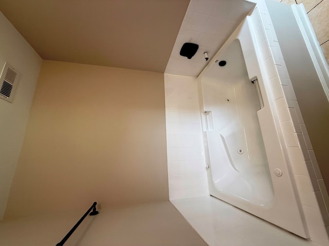 full bathroom with visible vents and walk in shower