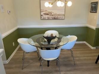 dining area featuring a chandelier and breakfast area