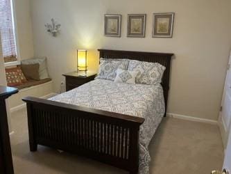 bedroom featuring light colored carpet