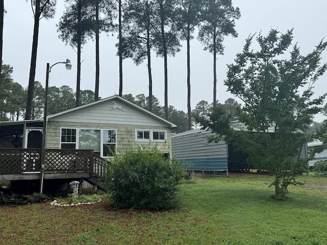 6207 Nautilus Dr, Horntown, VA 23395 - back of house featuring a deck and a yard