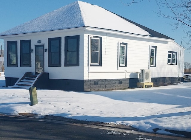 view of front of home featuring ac unit