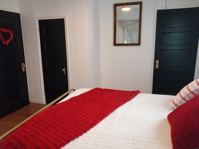 bedroom with hardwood / wood-style floors