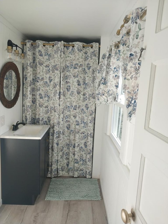 bathroom featuring wood-type flooring and vanity